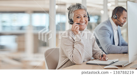 Computer, portrait and a senior woman in a call center for customer service, support or assistance online. Contact, smile and happy female consultant working at a desk in her professional crm office 138788219