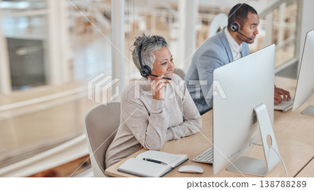 Computer, consulting and a senior woman in a call center for customer service, support or assistance online. Contact, headset and elderly consultant working at a desk in her professional crm office Computer, consulting and a senior woman in a call center for customer service, support or assistance online. Contact, headset and elderly consultant working at a desk in her professional crm office 138788289