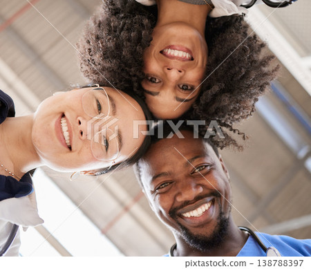Group portrait, doctors and below in circle, smile and teamwork for healthcare, wellness and friends in clinic. Man, women and diversity with support, motivation and goals for health in hospital job Group portrait, doctors and below in circle, smile and teamwork for healthcare, wellness and friends in clinic. Man, women and diversity with support, motivation and goals for health in hospital job 138788397