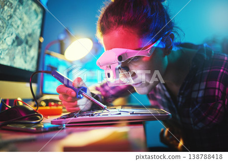 Woman, computer motherboard and soldering iron for manufacturing, microchip and it development. Information technology, circuit board and electronics for engineering, hardware and system with tools Woman, computer motherboard and soldering iron for manufacturing, microchip and it development. Information technology, circuit board and electronics for engineering, hardware and system with tools 138788418