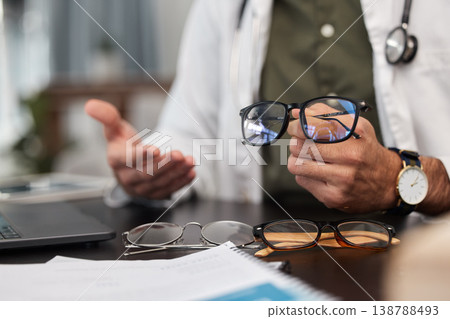 Glasses, choice and doctor hand in optometrist office with lens shopping and wellness option. Frame, vision and optician decision in clinic for eye support, health and medical exam with professional Glasses, choice and doctor hand in optometrist office with lens shopping and wellness option. Frame, vision and optician decision in clinic for eye support, health and medical exam with professional 138788493