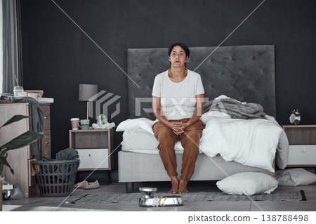 Tired, morning and a woman in the bedroom with chaos, messy and thinking. Idea, sad and a senior person with depression or mental health problem on the bed with insomnia or home stress with vision Tired, morning and a woman in the bedroom with chaos, messy and thinking. Idea, sad and a senior person with depression or mental health problem on the bed with insomnia or home stress with vision 138788498