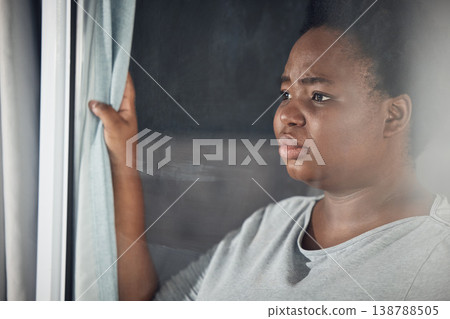 Curtain, thinking or black woman with depression, stress or mental health problem by window at home. Worry, lonely or tired African person with broken heart, loss or anxiety from emotional grief Curtain, thinking or black woman with depression, stress or mental health problem by window at home. Worry, lonely or tired African person with broken heart, loss or anxiety from emotional grief 138788505