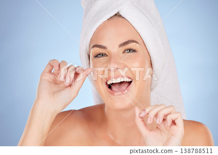 Dental floss, portrait or happy woman cleaning teeth for self care treatment, bathroom morning routine or tooth shine. Beauty, face or female model excited for mouth oral hygiene on studio background Dental floss, portrait or happy woman cleaning teeth for self care treatment, bathroom morning routine or tooth shine. Beauty, face or female model excited for mouth oral hygiene on studio background 138788511