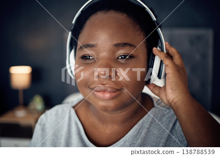 Crying, sad and black woman with headphones for music, sound or audio. Tears, radio and plus size African person listening, hearing and streaming podcast with depression, crisis and problem in home Crying, sad and black woman with headphones for music, sound or audio. Tears, radio and plus size African person listening, hearing and streaming podcast with depression, crisis and problem in home 138788539