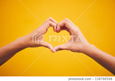 Heart, hands and person in studio with thank you, message or gesture on orange background space. Emoji, frame and human fingers with self love, gratitude and kindness, empathy and hope of healing Heart, hands and person in studio with thank you, message or gesture on orange background space. Emoji, frame and human fingers with self love, gratitude and kindness, empathy and hope of healing 138788588