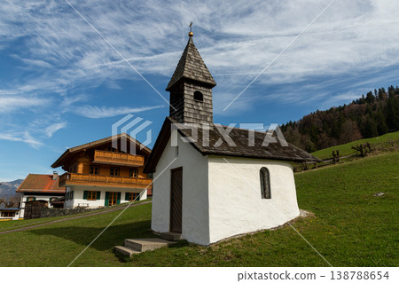 Small white countryside chapel under a blue sky Small white countryside chapel under a blue sky 138788654
