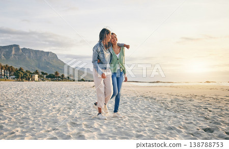 Love, beach and lesbian couple hug while walking together on sand, sunset holiday adventure or date. Lgbt women, bonding and relax on ocean vacation with romance, pride and happy travel in nature. Love, beach and lesbian couple hug while walking together on sand, sunset holiday adventure or date. Lgbt women, bonding and relax on ocean vacation with romance, pride and happy travel in nature. 138788753