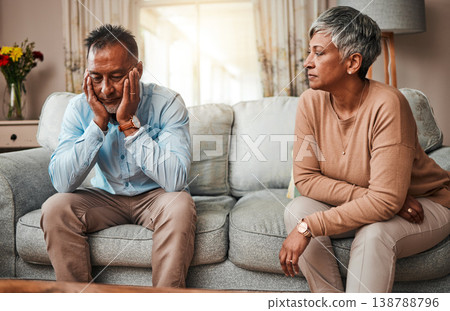 Angry, senior couple and fight on sofa, divorce and conflict with a breakup, depression and stress. Sad, old woman and elderly man with mental health, cheating and separation with crisis at home 138788796