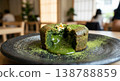 Matcha fondant chocolate with a rich, melting sauce inside, garnished with gold leaf - a modern Japanese dessert. 138788859