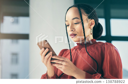 Phone, online and business black woman in office for social media, browse internet and mobile app. Networking, professional and female worker on smartphone for website, research and communication Phone, online and business black woman in office for social media, browse internet and mobile app. Networking, professional and female worker on smartphone for website, research and communication 138788922