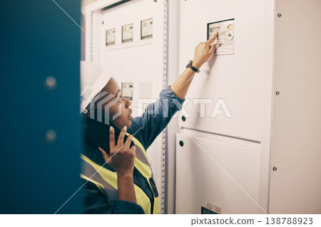 Black woman, electrical technician or phone call in control room for engineering system, electricity or maintenance service. Female electrician talking on mobile tech, check industrial board or power Black woman, electrical technician or phone call in control room for engineering system, electricity or maintenance service. Female electrician talking on mobile tech, check industrial board or power 138788923