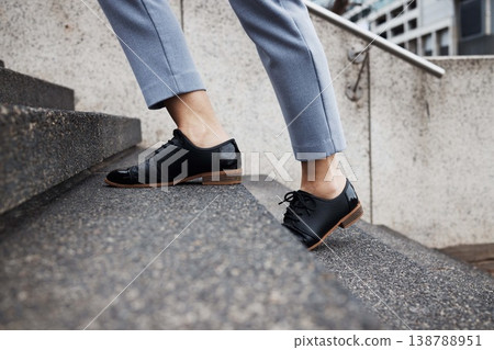 Stairs, city person and legs walking, travel or on morning journey, outdoor commute or on urban trip. Concrete steps, ground and closeup shoes, feet or commuter climbing staircase of building Stairs, city person and legs walking, travel or on morning journey, outdoor commute or on urban trip. Concrete steps, ground and closeup shoes, feet or commuter climbing staircase of building 138788951