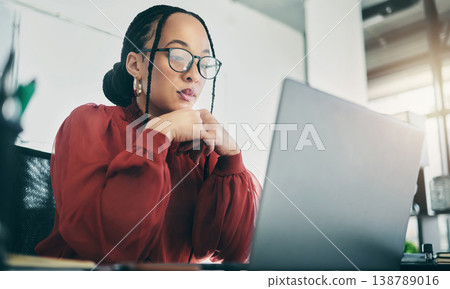 Office, laptop and business woman reading, planning and focus on project review, online report feedback or research. Ideas, problem solving or professional female designer working on design plan Office, laptop and business woman reading, planning and focus on project review, online report feedback or research. Ideas, problem solving or professional female designer working on design plan 138789016