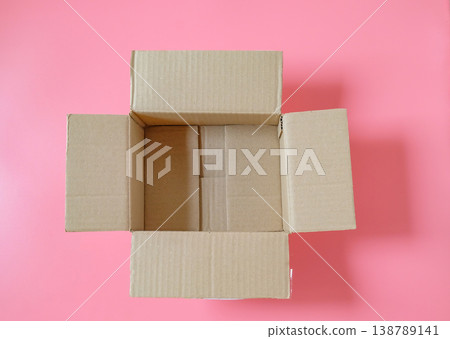 Opened cardboard box on  top view. 138789141