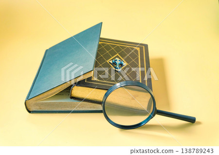 A magnifying glass with heard cover bible. A magnifying glass with heard cover bible. 138789243