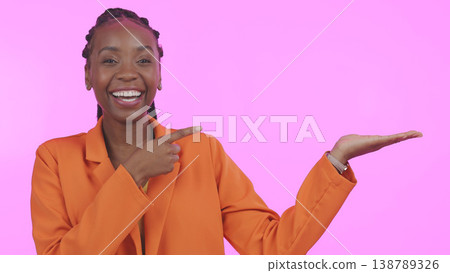 Black woman, pointing and advertising in studio on empty hand, palm or mock up space. Portrait, happy or person with promotion for business, marketing or offer and presentation on pink background Black woman, pointing and advertising in studio on empty hand, palm or mock up space. Portrait, happy or person with promotion for business, marketing or offer and presentation on pink background 138789326