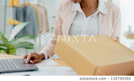 Hand, laptop and person, box for distribution or shipping, check stock list for small business owner and delivery. Supply chain, inventory and package from supplier, e commerce courier and logistics Hand, laptop and person, box for distribution or shipping, check stock list for small business owner and delivery. Supply chain, inventory and package from supplier, e commerce courier and logistics 138789368
