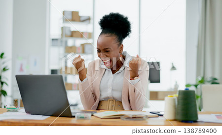 Happy black woman, laptop and fist pump in winning celebration, promotion or bonus at office. Excited African female person smile on computer for good news, achievement or sale discount at workplace Happy black woman, laptop and fist pump in winning celebration, promotion or bonus at office. Excited African female person smile on computer for good news, achievement or sale discount at workplace 138789400