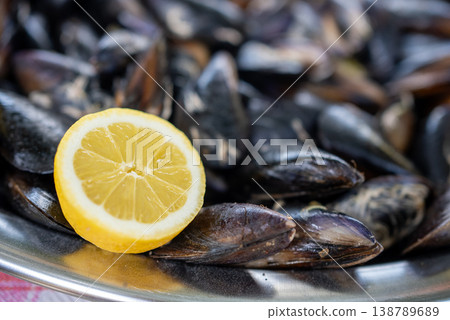 Fresh Mussels with Lemon Slices Background Seafood Texture Fresh Mussels with Lemon Slices Background Seafood Texture 138789689