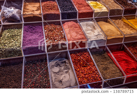 Colorful assortment of spices in market containers. Colorful assortment of spices in market containers. 138789715