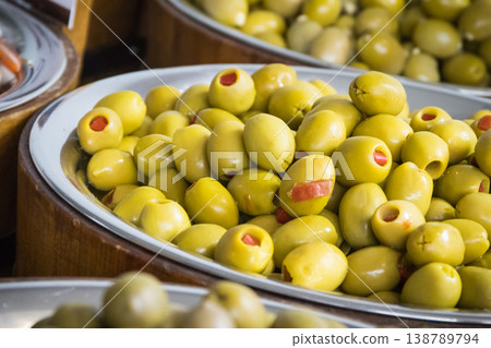Fresh green olives in barrels. Traditional Greek addition to dishes Fresh green olives in barrels. Traditional Greek addition to dishes 138789794