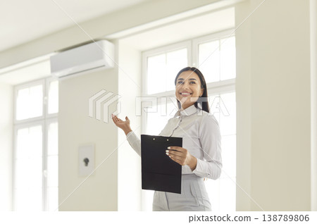 Portrait Of A Happy Woman Realtor Presenting A New Home Or Office 138789806