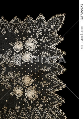 Close up of vintage lace fabric white on black background embroidery Close up of vintage lace fabric white on black background embroidery 138789923
