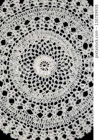 Close up of vintage lace fabric white on black background embroidery Close up of vintage lace fabric white on black background embroidery 138789938