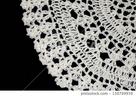 Close up of vintage lace fabric white on black background embroidery Close up of vintage lace fabric white on black background embroidery 138789939