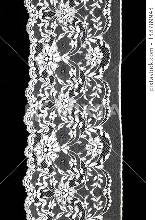Close up of vintage lace fabric white on black background embroidery Close up of vintage lace fabric white on black background embroidery 138789943