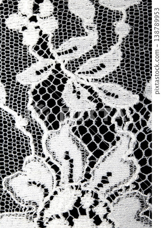 Close up of vintage lace fabric white on black background embroidery 138789953