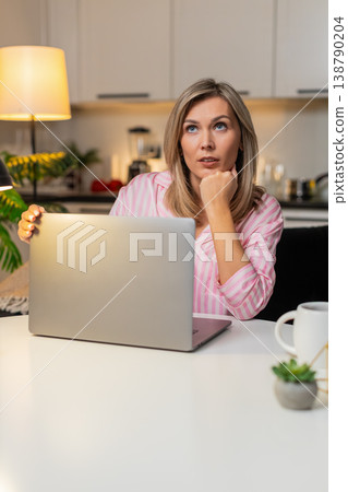 Adult woman freelancer tired powers off laptop closes lid decides to continue tomorrow focused fresh 138790204