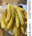 Golden crispy potato fries photo closeup 138790950