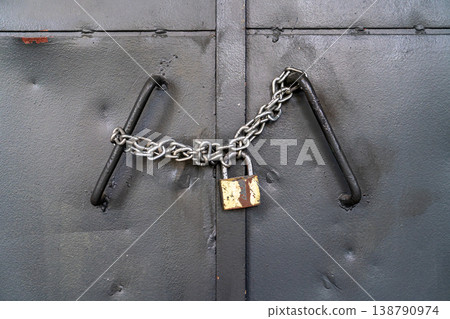Locked Metal Door with Chain and Padlock Security Concept Locked Metal Door with Chain and Padlock Security Concept 138790974