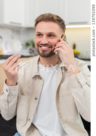 Young man talks with friend on smartphone gestures explains decision then warm goodbye friendly call Young man talks with friend on smartphone gestures explains decision then warm goodbye friendly call 138791098