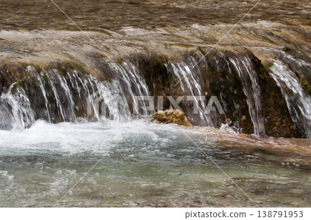 Waterfall at the river the Drau near Ferlach in Carinthia, Austria 138791953
