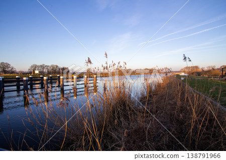 Sunrise on a February morning at river the IJssel in the Achterhoek. Photo taken in Laag-Keppel in the Netherlands. Sunrise on a February morning at river the IJssel in the Achterhoek. Photo taken in Laag-Keppel in the Netherlands. 138791966