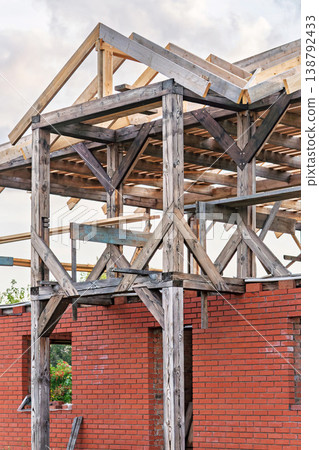 Construction site of an unfinished entrance area of an abandoned cottage in a rural setting 138792433