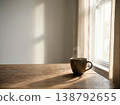 Cozy morning coffee with steam in warm sunlight minimal lifestyle. 138792655