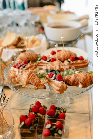 Catering table with croissants, desserts and fresh berries for festive buffet or brunch 138792785