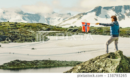 Tourist with norwegian flag in mountains Tourist with norwegian flag in mountains 138793265