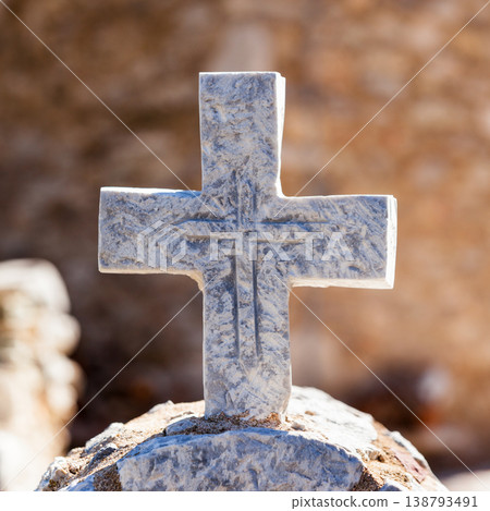 Greek stone cross on burial ground 138793491