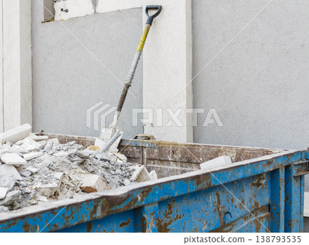 Full construction waste debris container 138793535
