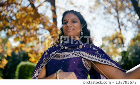Indian woman smiling, wearing traditional dress outdoors Indian woman smiling, wearing traditional dress outdoors 138793672