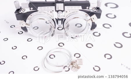 Optical device with large circular lenses on black frame 138794056