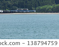 The Limited Express Umisachi Yamasachi runs across a railway bridge over the Hosoda River, which flows into Odotsu Beach in Nichinan City, Miyazaki Prefecture. 138794759