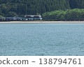 The Limited Express Umisachi Yamasachi runs across a railway bridge over the Hosoda River, which flows into Odotsu Beach in Nichinan City, Miyazaki Prefecture. 138794761