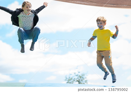 Children jumping high together with joyful energy Children jumping high together with joyful energy 138795002