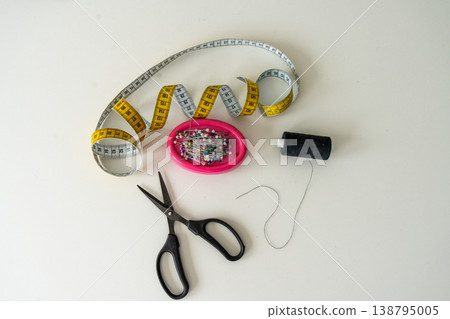 Sewing Machine and Tailoring Tools on White Background. Sewing Machine and Tailoring Tools on White Background. 138795005
